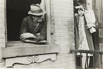 HELEN LEVITT (1913-2009) Girl holding bread and a man in the window, NYC.                                                                        